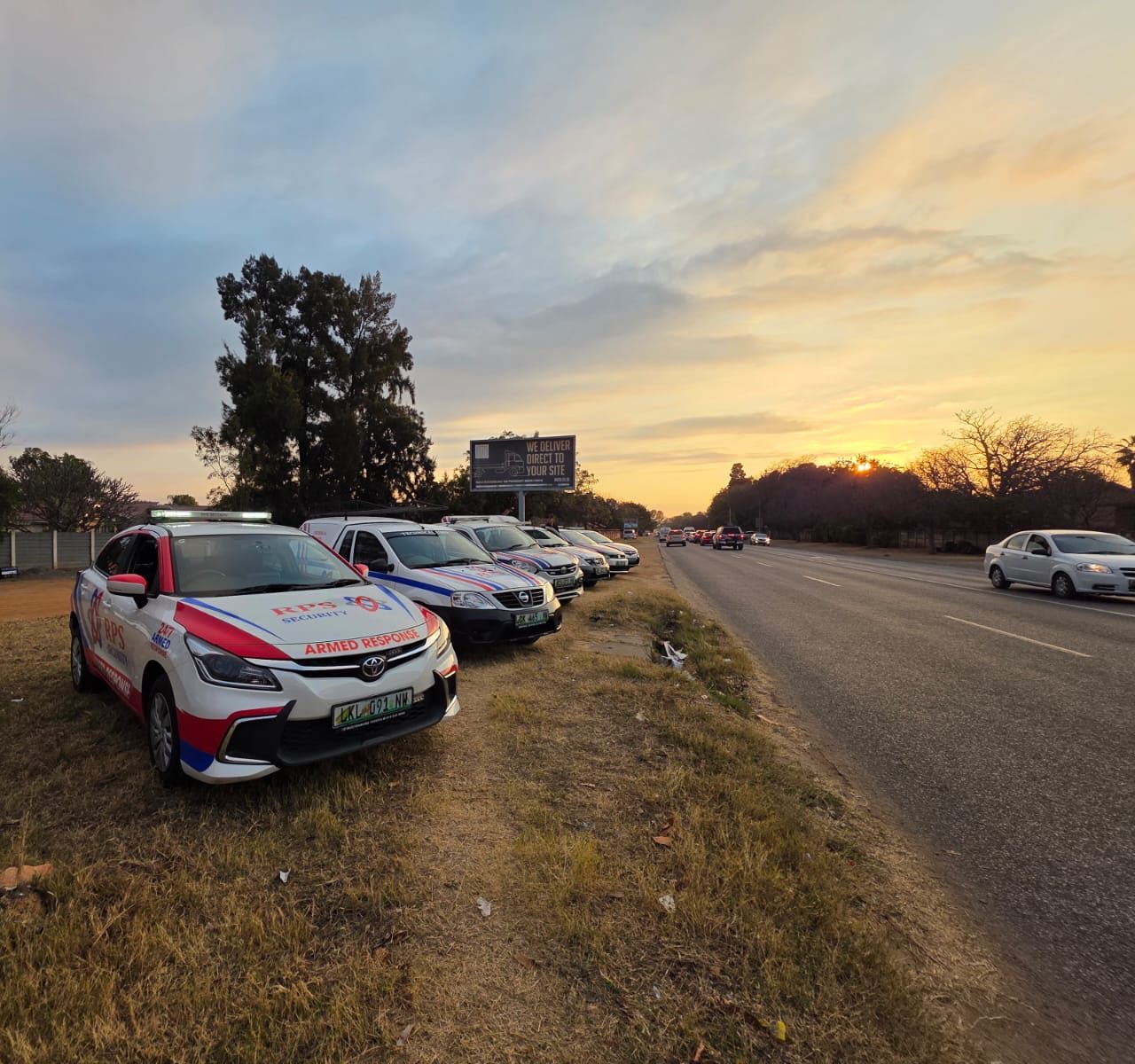 RPS Security armed response vehicles on a Rustenburg roadside at golden hour